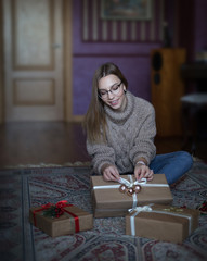 Girl preparing Christmas gifts