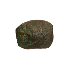 Concave ancient copper or bronze byzantine coin isolated on white