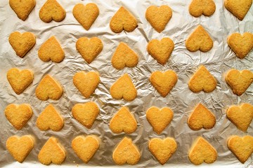flatlay of heart shaped fresh baked cookies as a symbol of St. Valentine's Day