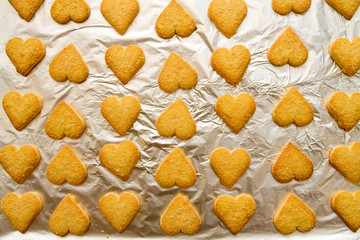 flatlay of heart shaped fresh baked cookies as a symbol of St. Valentine's Day