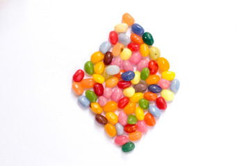 Tiles made of jelly beans isolated on white