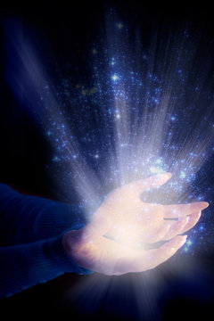 woman hands with rays of light like spiritual divine soul magic religious concept 