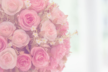 Obraz na płótnie Canvas Beautiful decoration artificial rose flower background for valentine day or wedding card.