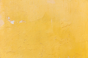 Bright yellow color, painted wall texture grunge background