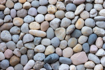 blue and gray sea pebble stone wall texture background.