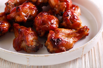 Roast chicken wings in a plate,