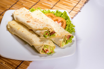 Fresh tortilla wraps with vegetable filling and chicken