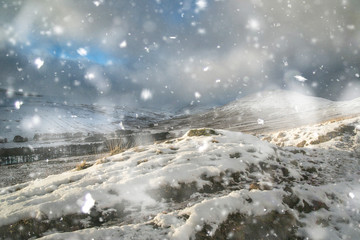 Beautiful landscape of snow covered mountains during late afternoon in Winter in heavy snow storm