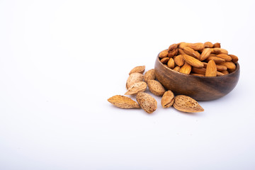 Almond nuts with shell on isolated white background