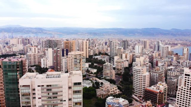 Aerial footage of downtown Beirut, Lebanon, at the sunset. Beirut skyline with skyscrappers in the evening, drone footage. Camera ascending over Beirut downtown.
