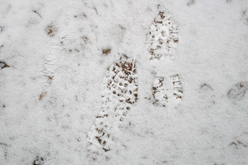 Traces of man in the snow. Winter foot Traveling in the woods