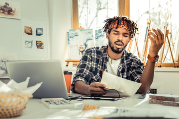 Young creative artist feeling fed up while working all day long