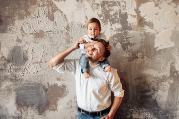 Obraz na płótnie Canvas Young father with small son. Family portrait