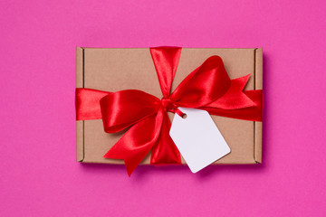 Valentines day romantic gift ribbon bow,gift tag,present,seamless pink background,copy text space