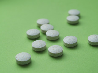 pills on green background