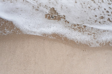 The beach background,white sea wave,clear sand,beauty by nature