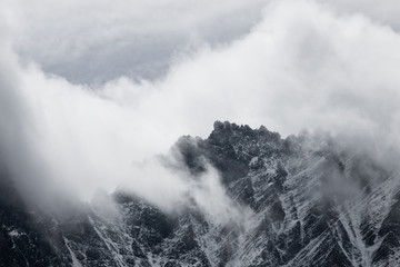 Detail of mountain in the clouds in Alps, Austria