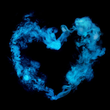 heart shape from blue smoke isolated on black background