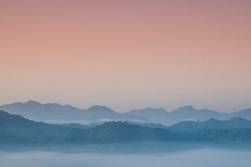 Foggy and mountain on edge range with copy-space on sky