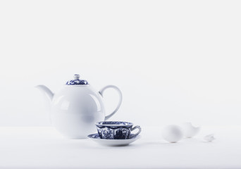 white  teapot on white background