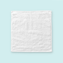 White cotton towel mock up template square size fabric wiper isolated on blue background with...