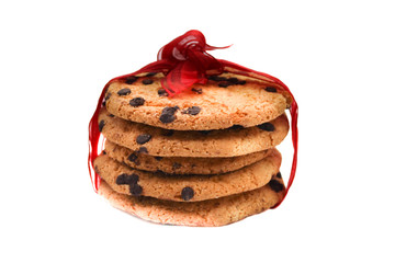 oatmeal cookies with chocolate drops, tied with a red ribbon, isolated on white background