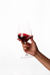 hand holding a glass of red wine