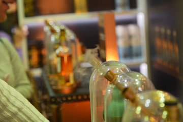 Fototapeta premium Glass flasks for vapers. Vaping whiskey. Evaporator of whiskey for the use of the drink in the form of smoke.