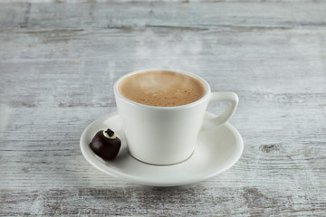 cup of coffee on wooden table