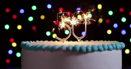 Cake Celebrating 50th Birthday With Number Shaped Sparklers Shot In Slow Motion