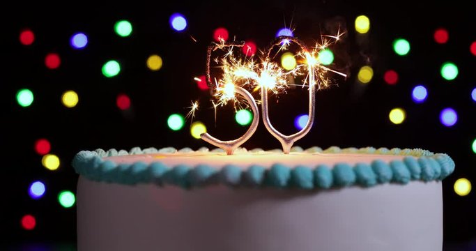 Cake Celebrating 50th Birthday With Number Shaped Sparklers Shot In Slow Motion