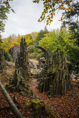 Old stone arched bridge. In a stony area.