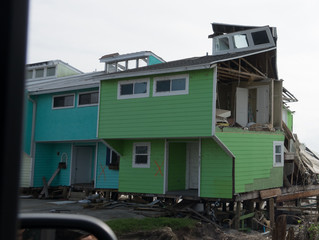 Missing Wall on Green Townhouse on Gulf Coast in the Aftermath of Hurricane Michael