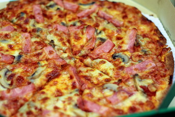 pizza in a cardboard box from above pizza delivery
