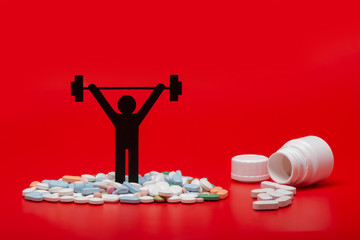 Weight lifting pictogram with pills