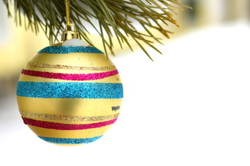 Old vintage Christmas tree toy in retro style on pine branch in winter outside on white snow with place for inscription on festive Christmas greeting card