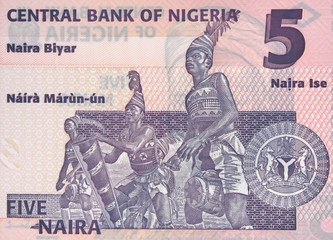 Nigeria 5 naira banknote, African dancers. Nigerian money currency close up. Africa economy.