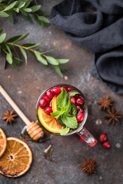 Tea With Cranberry, Orange, Spices And Mint In Glass Cup. Top View