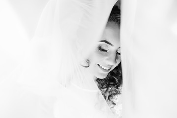 the face of the bride who closed her eyes and around the tulle o