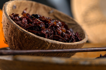 Close-up apple shisha in coconut shell. Preparation for hookah smoking