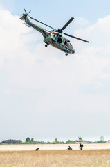 Fototapeta na wymiar Soldiers on a rescue military operation with helicopter.