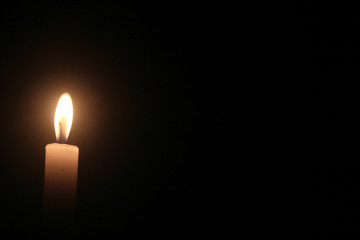 light of candle in the dark.