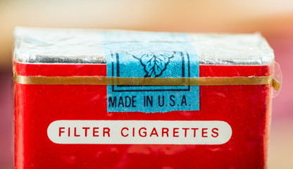 Made in USA label. Vintage packet of cigarettes produced in the USA. Banderoll on top of the pack.