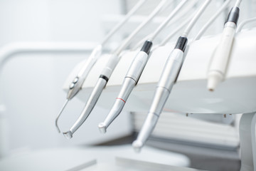 Close-up view on the professional dental instruments in the white office