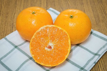 Ripe and Sweet Oranges on A Wooden Table