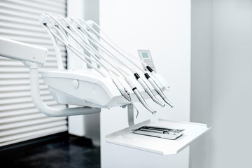 Close-up view on the professional dental instruments in the white office