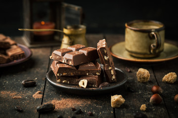 Fototapeta na wymiar Chocolate with hazelnuts and cocoa beans