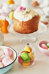 Easter orthodox sweet bread, kulich and colorful eggs with flowers. Holidays breakfast concept with copy space. Retro style. Easter greeting card template