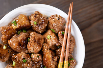 Asian Orange Chicken with Green Onions for Dinner. Chinese chicken sweet and sour sauce.