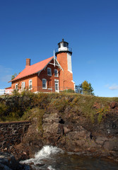 Fototapeta na wymiar Eagle Harbor Lighthouse and Cliff